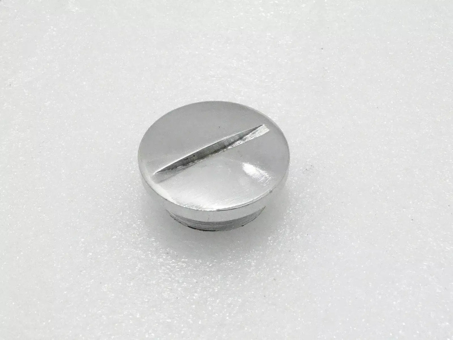 Royal Enfield chain case plug made of durable metal with a polished finish