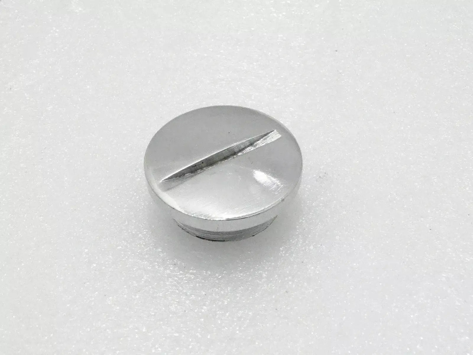 Royal Enfield chain case plug made of durable metal with a polished finish