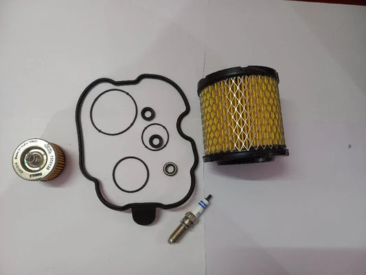 Royal Enfield oil filter service kit with filter, gasket, and spark plug for maintenance