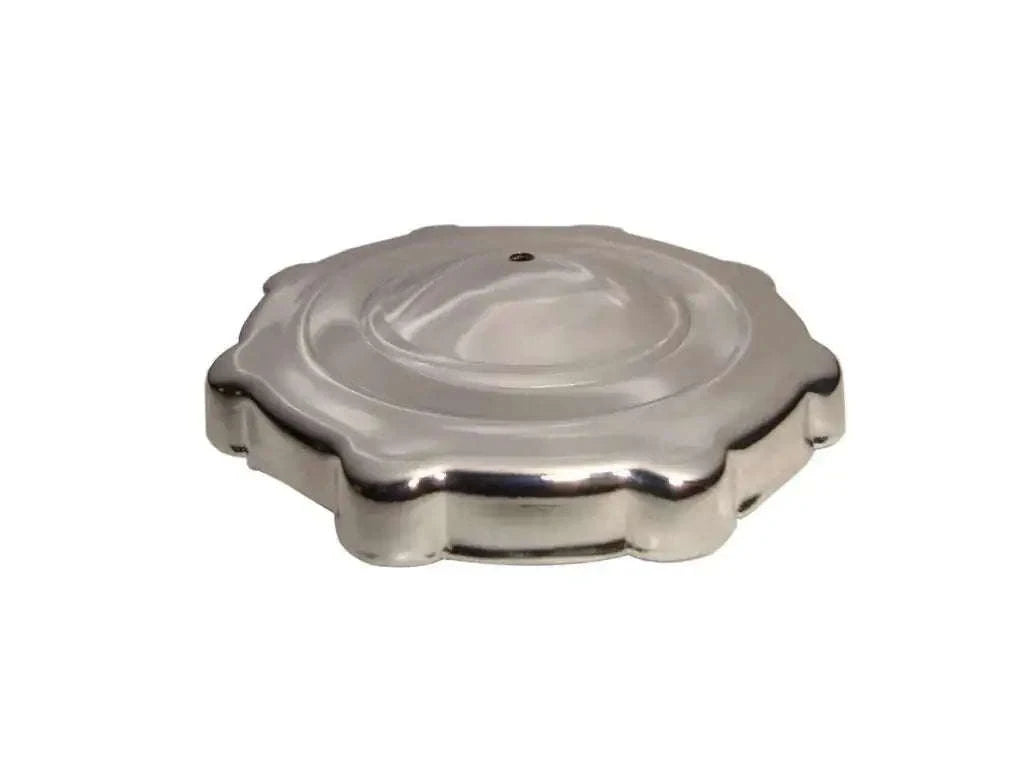 Metal push-style fuel tank cap with circular top