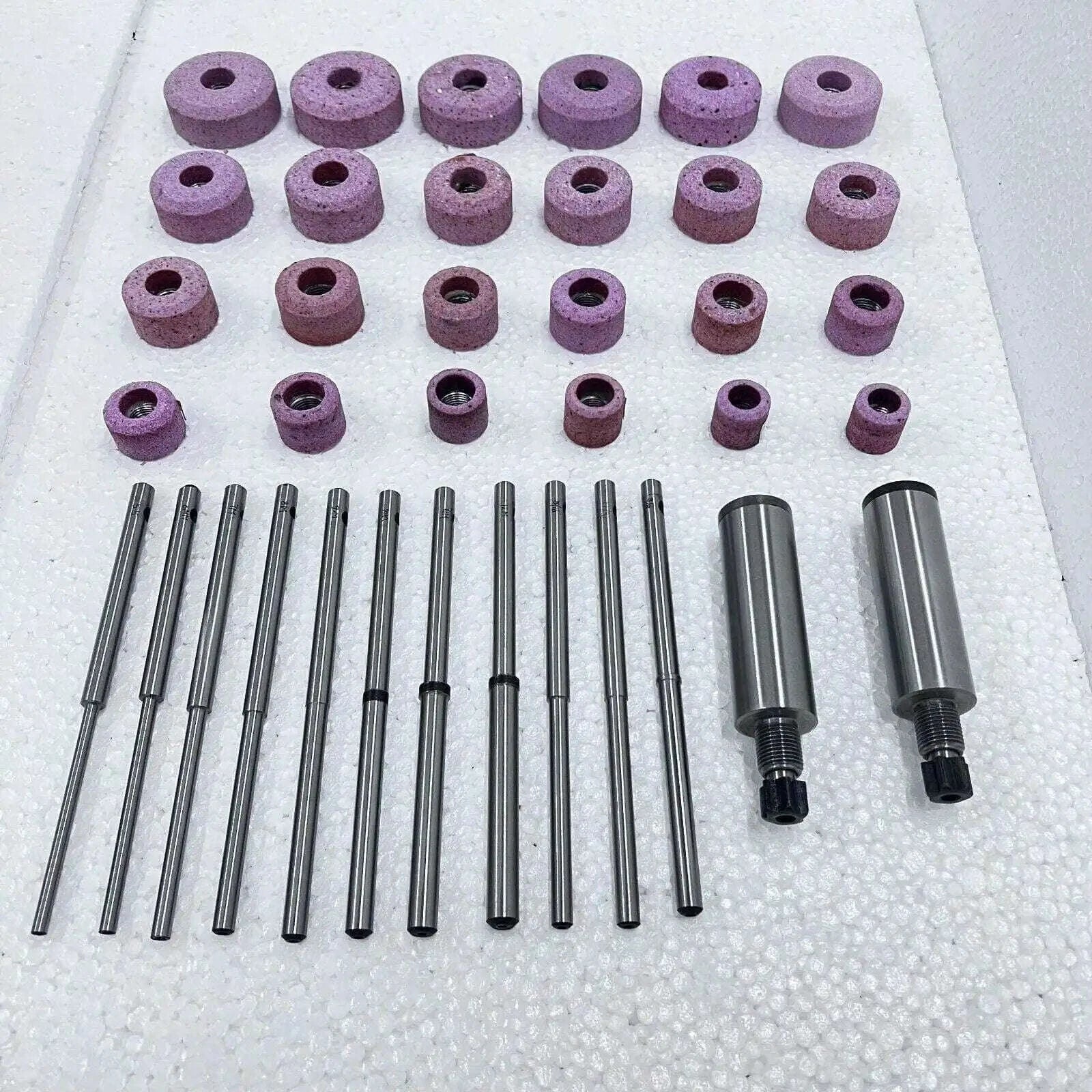 Sioux valve seat grinding wheels set with multiple sizes in pink abrasive material for valve seat resurfacing