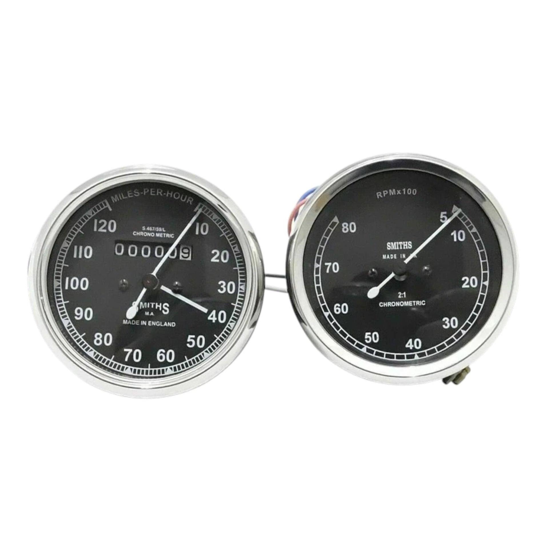 Speedometer gauge pair with chrome bezels, dual dials for mph and tach