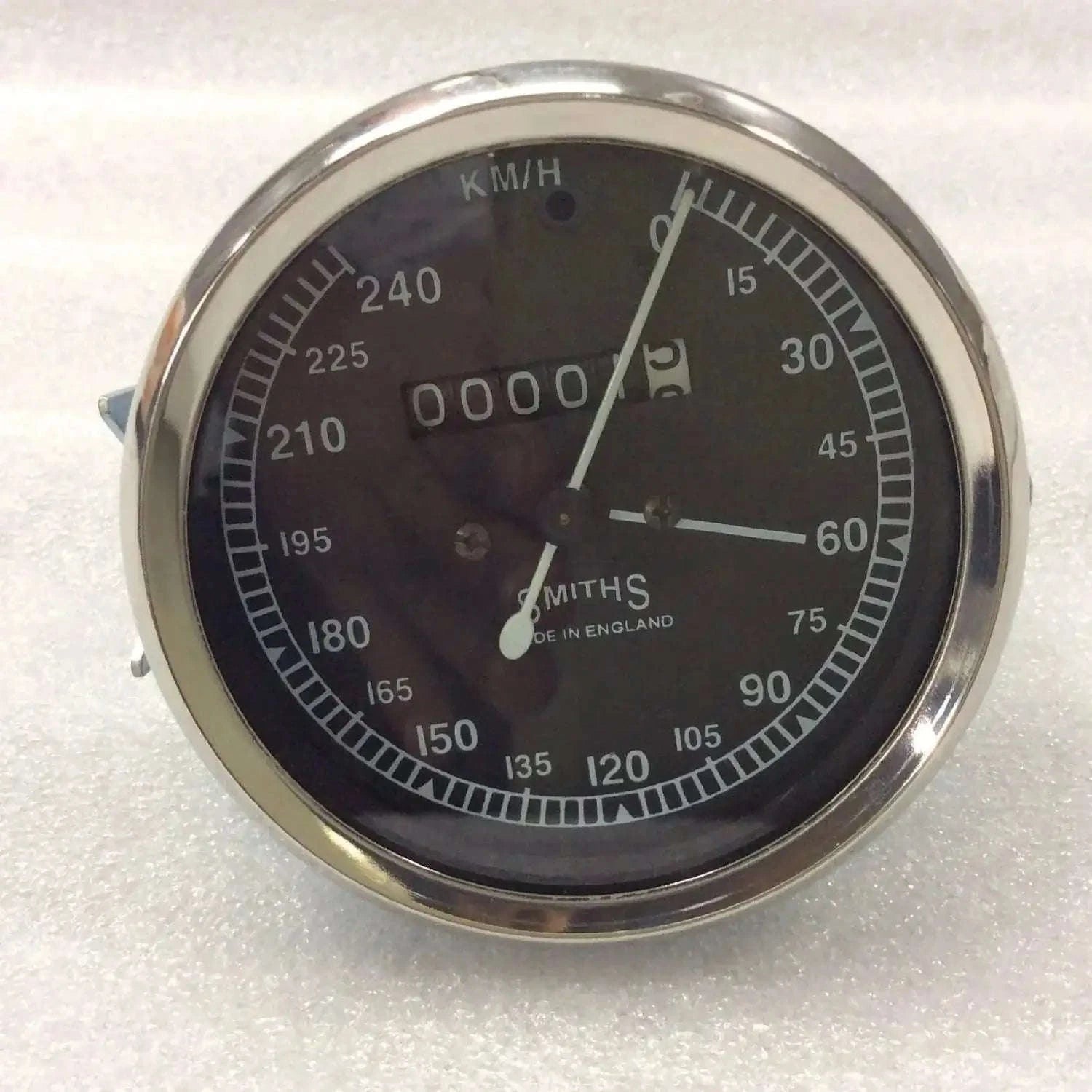 Smiths 120mm motorcycle speedometer with black face and chrome casing, ideal for vehicle dashboard installation