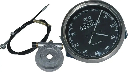 Smiths motorcycle speedometer gauge with black face, chrome bezel, and wiring harness