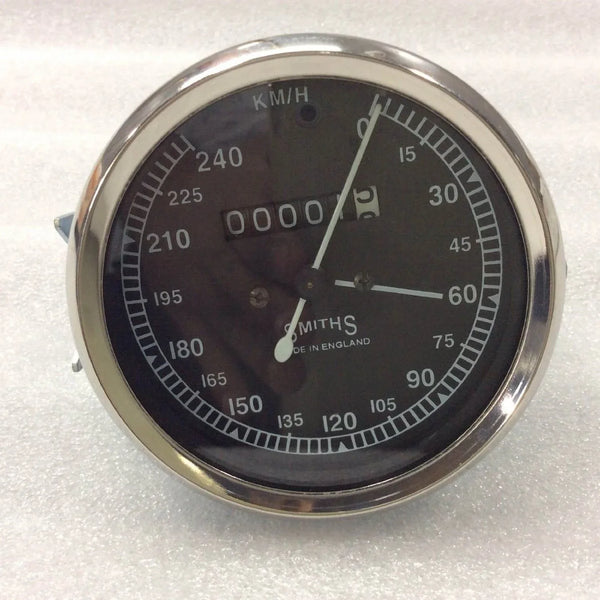 Round SMITHs speedometer gauge with black dial and chrome bezel, km/h scale
