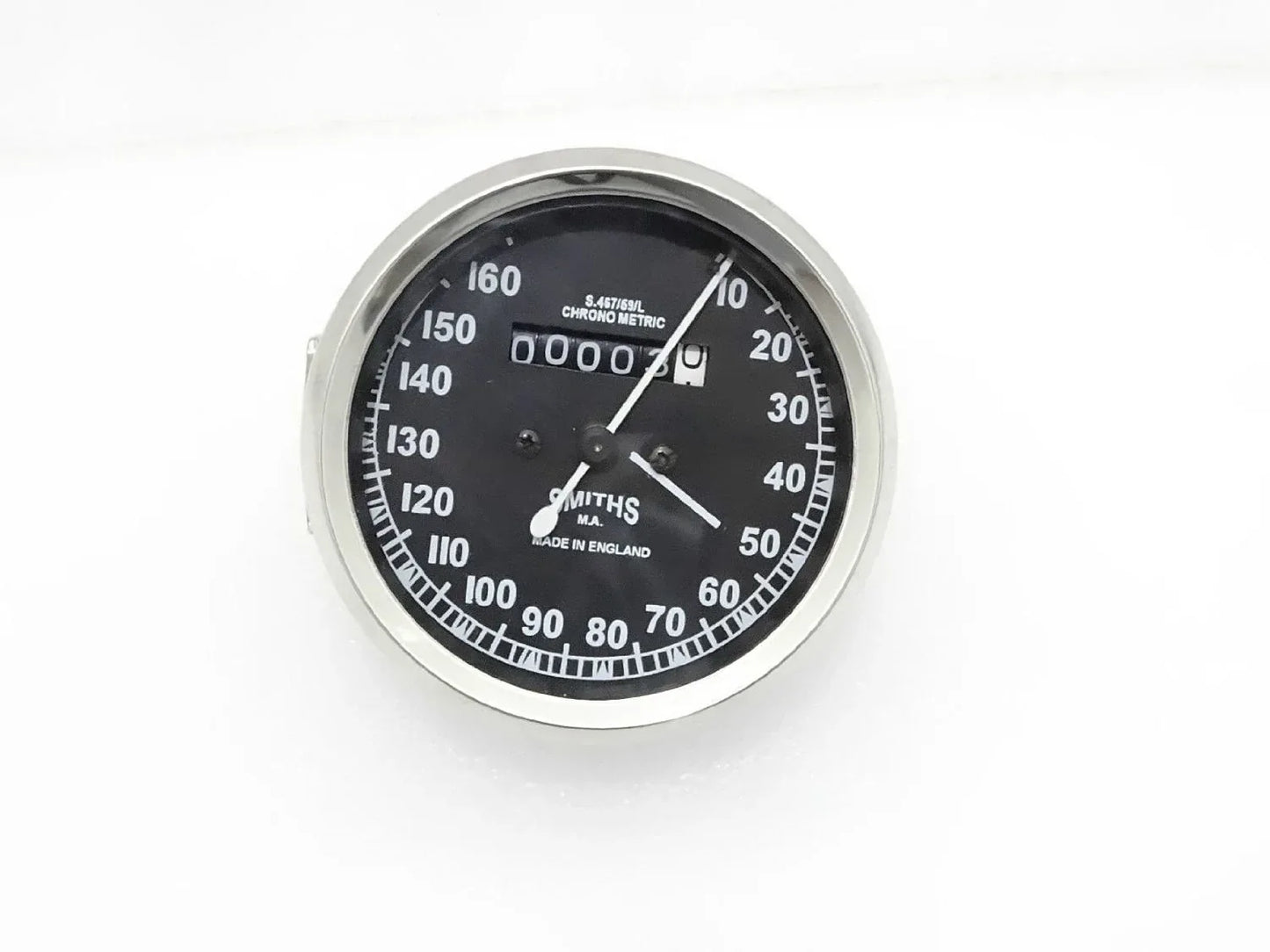 Black dial speedometer with chrome bezel and white numerals