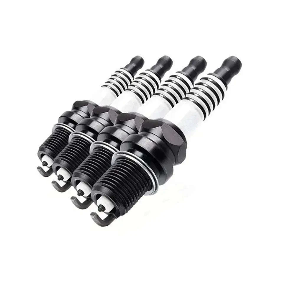 Spark plugs set with black hex bodies and silver insulators, multiple pieces