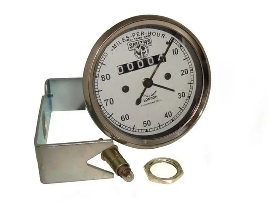 Classic white-face speedometer dial with brass bezel and metal mounting bracket