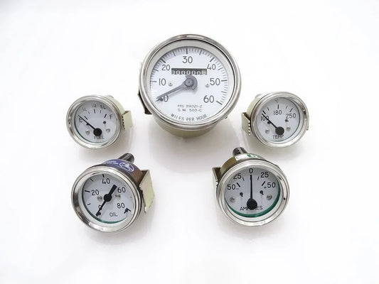 Round analog gauge kit with white faces, speedometer, oil, temp, fuel, amp indicators
