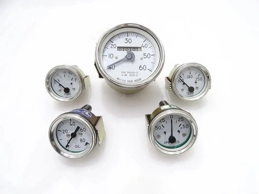 Round analog gauge kit with white faces, speedometer, oil, temp, fuel, amp indicators