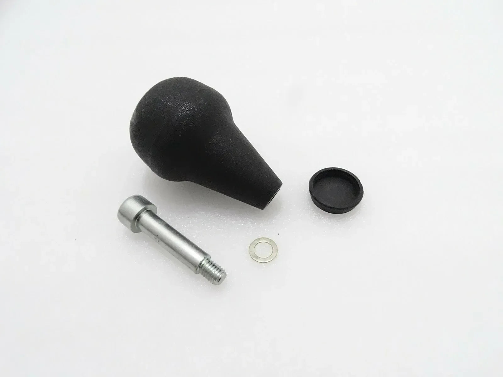 Steering knob kit with black rubber grip, metal shaft, and retaining ring
