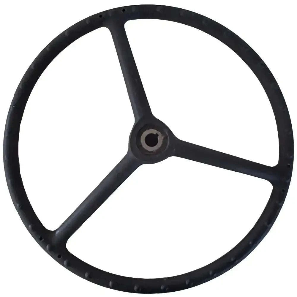 Black steering wheel with round rim, three spokes, and center hub opening.