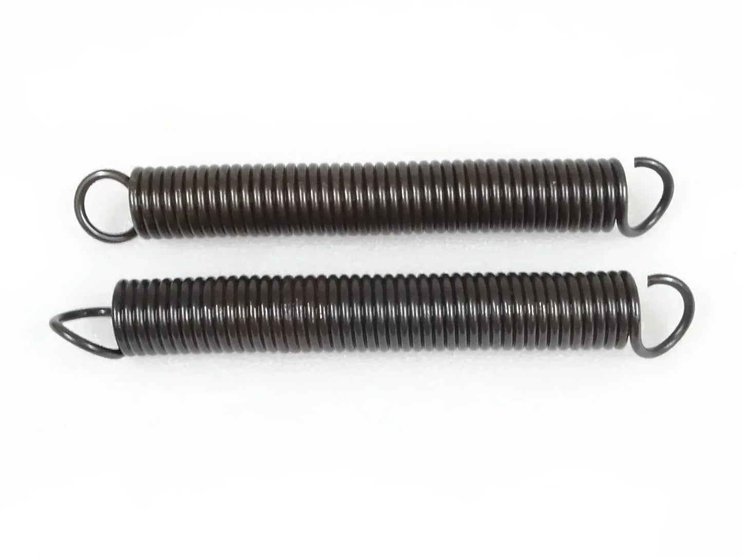Brake pedal return spring set: two coiled metal springs with hook ends