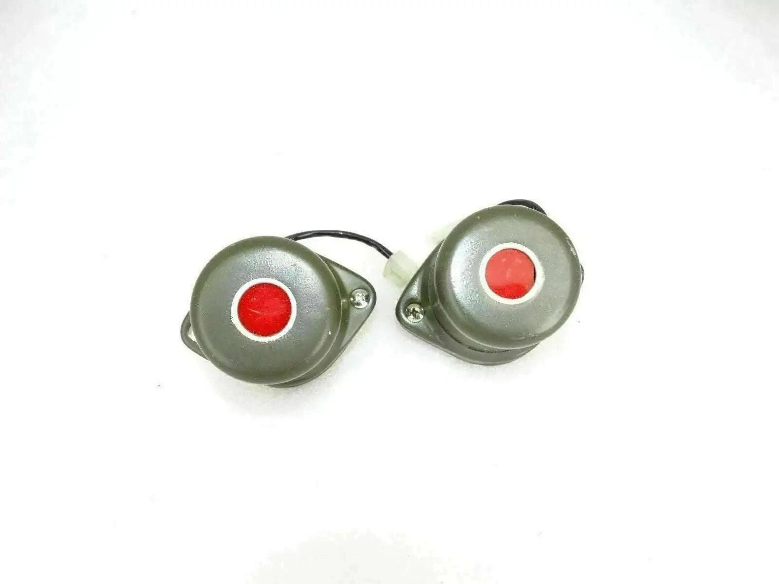 Pair of military blackout stop lights with olive green housings and red lenses