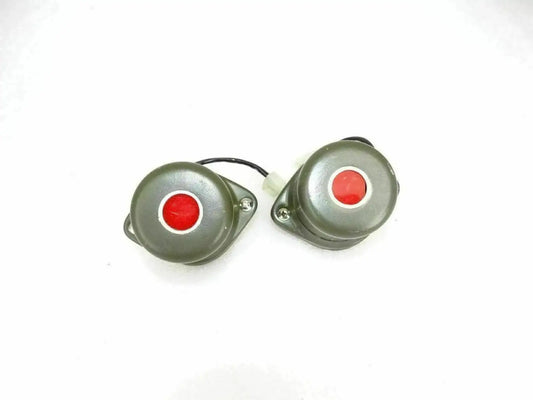 Pair of military blackout stop lights with olive green housings and red lenses