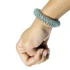 ACS Acupressure Bracelet with a Hand in a Fist, Complemented by Sujok Finger Massager Rings