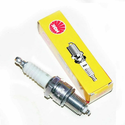 Spark plug with white ceramic insulator and metal threaded tip, in yellow box.