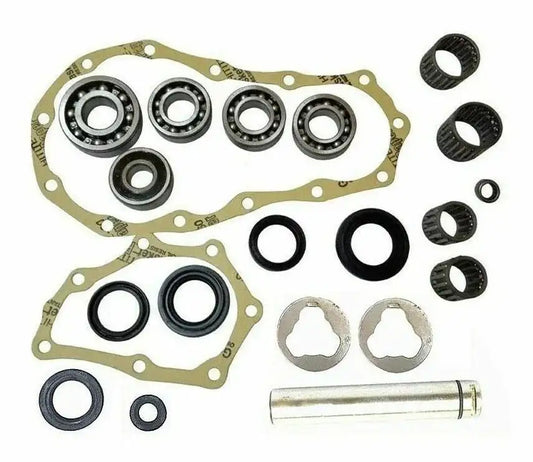 Transfer case rebuild kit with bearings, gaskets, seals, and sleeve