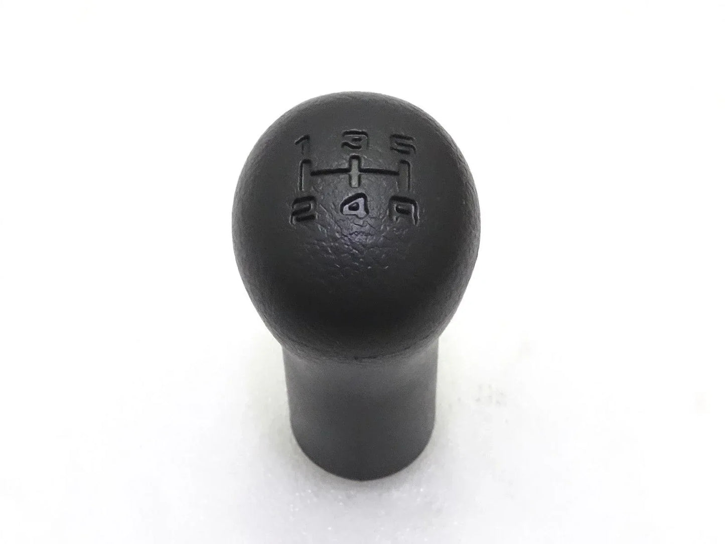 Black gear shift knob with embossed shift pattern on round top