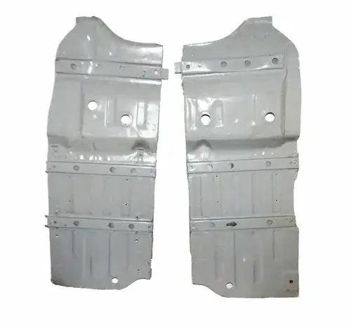 Pair of silver metal floor panels with stamped holes and mounting tabs
