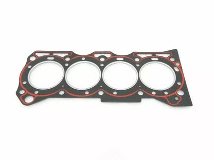 Engine head gasket with four cylinder cutouts, black with red seal rings