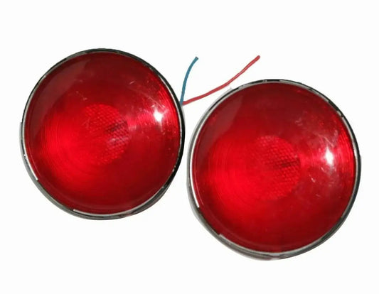Pair of red tail light lenses with chrome bezels