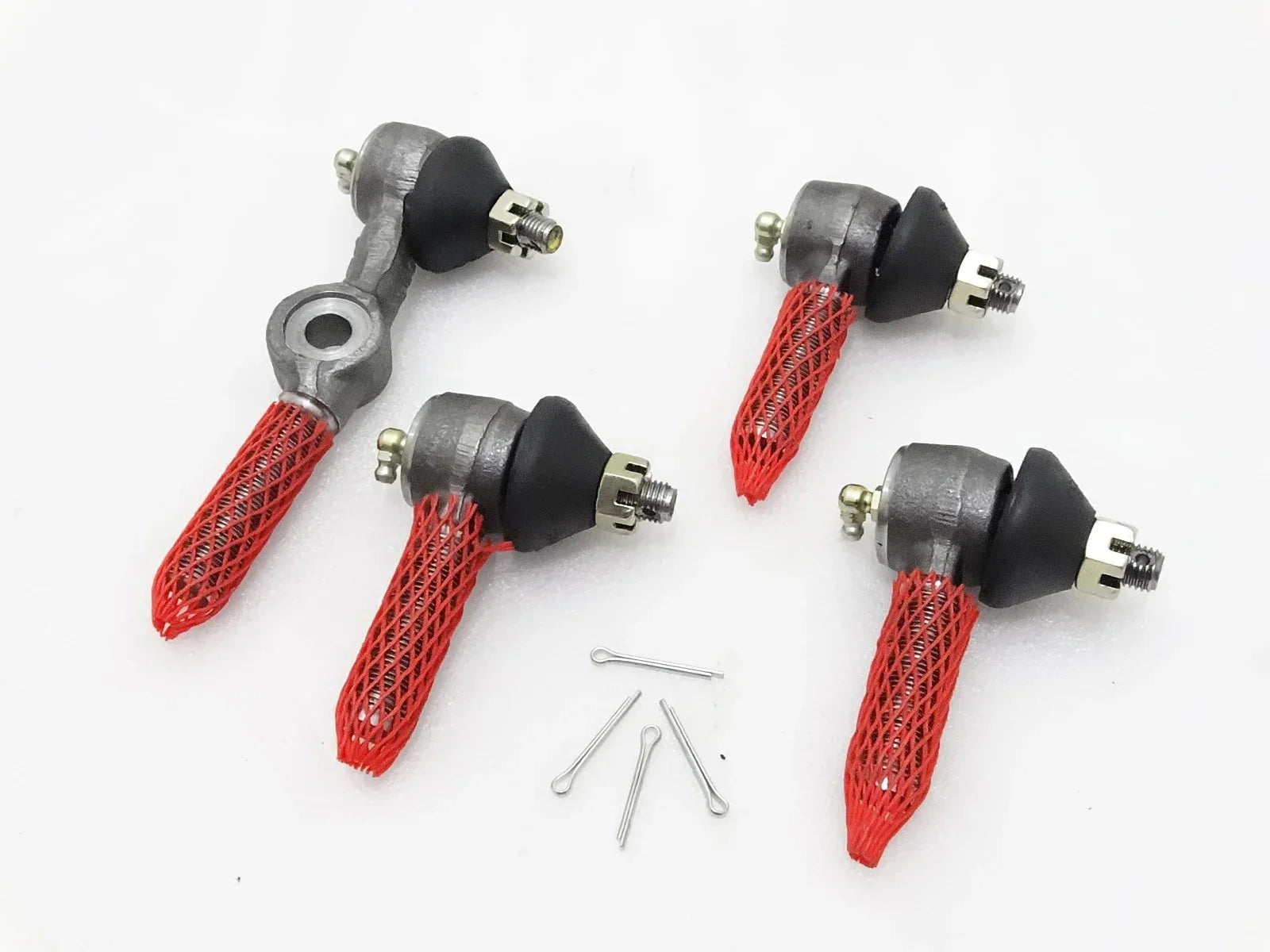 Steering tie rod ends with red mesh boots and retaining hardware, right-hand drive