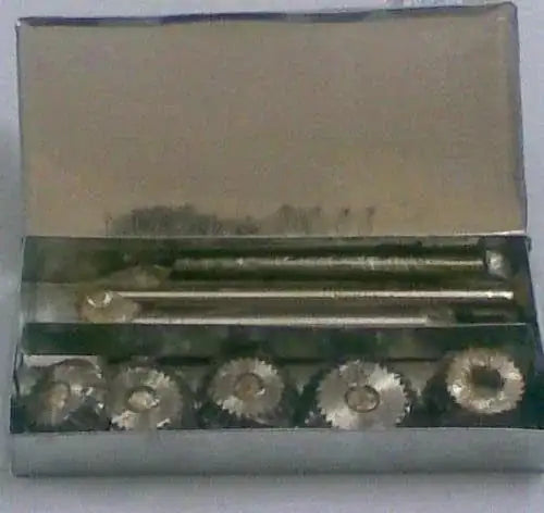 Valve seat cutter set, carbon steel, in metal case with 5 cutting heads and tools.