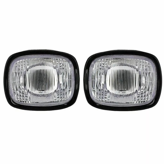Tractor headlamp set with clear lenses, durable black housing, ideal for enhancing visibility on tractors