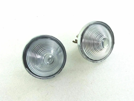 Pair of clear round parking/turn signal lenses with chrome bezels