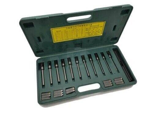 Universal boring cutter tool set in a green carrying case with various cutting bits
