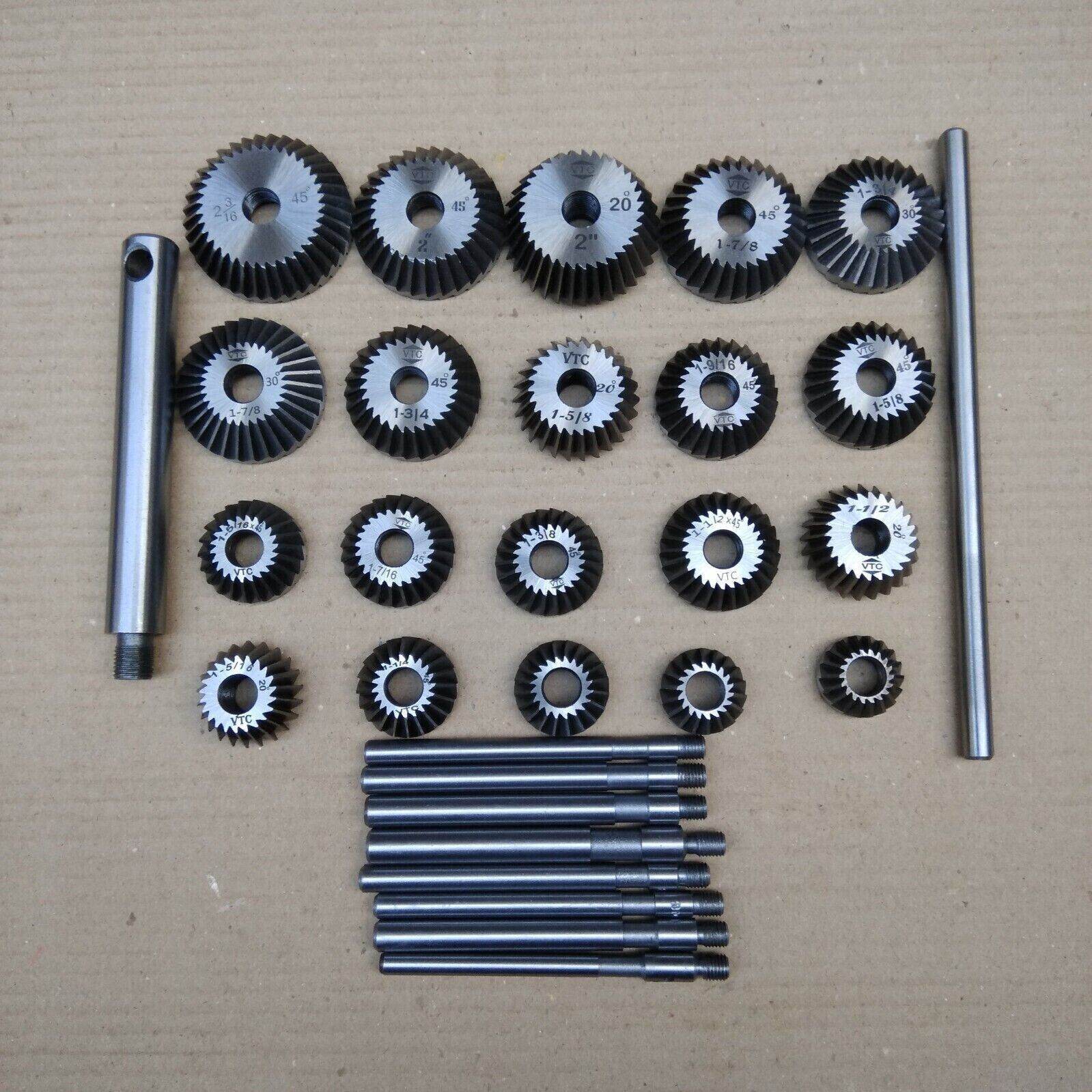 Comprehensive valve seat cutter set with various sizes of cutting tools and attachments for precision machining