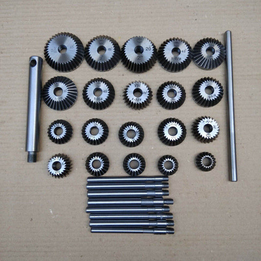 Comprehensive valve seat cutter set with various sizes of cutting tools and attachments for precision machining