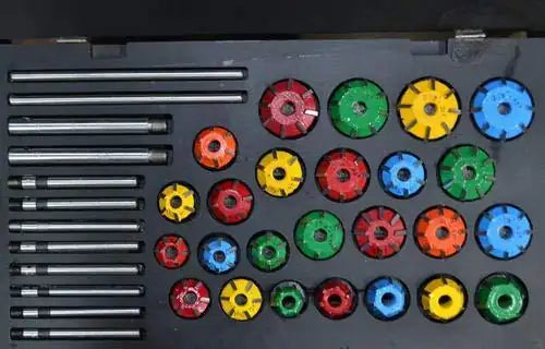 Valve seat cutter set with multiple carbide cutters, colored wheel tips and metal shanks
