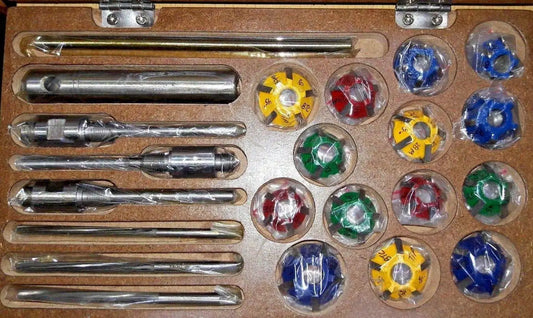 Carbide tipped valve seat cutter tool set with various sizes and accessories for automotive applications