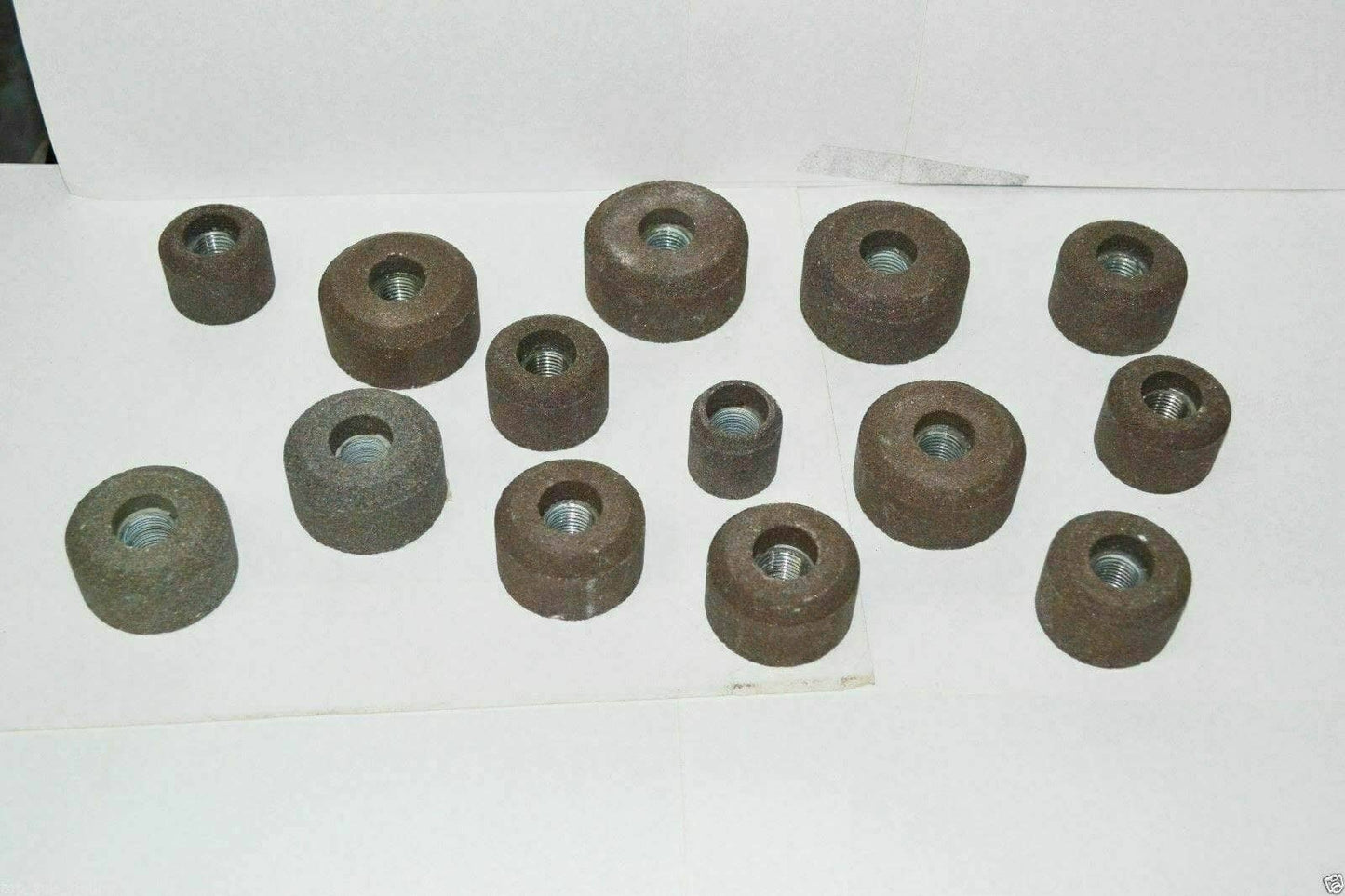 Valve seat grinding stone set featuring various sizes for automotive valve seat repair