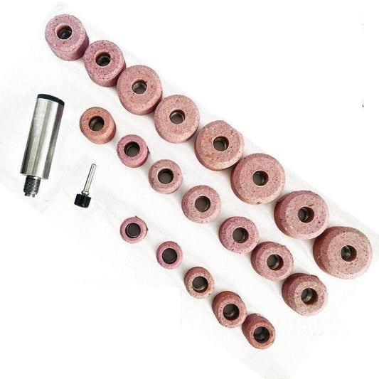Set of valve seat grinding stones with a Black and Decker holder, includes various sizes for precise grinding.
