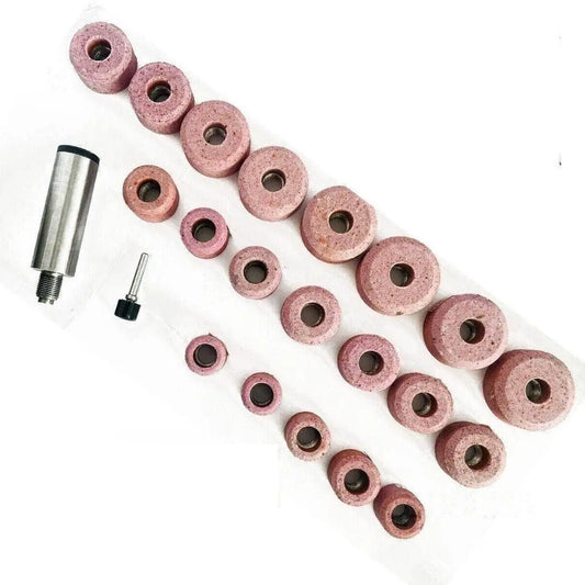 Set of valve seat grinding stones with a Black and Decker holder, includes various sizes for precise grinding.