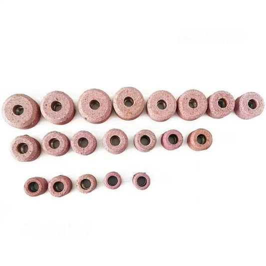 Set of valve seat grinding stones in various sizes, made of durable material for precision engine repairs