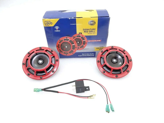 Red and black car horn set with wiring harness, two horns and retail box