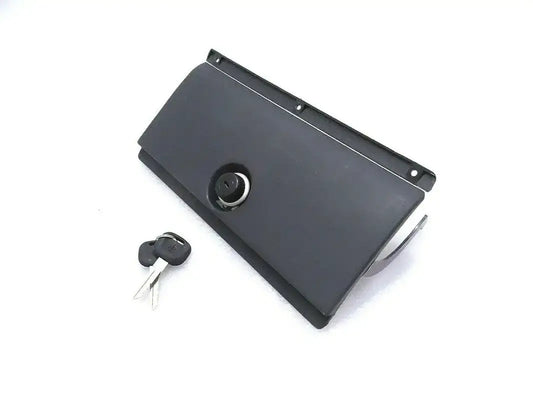 Glove box cover with lock, dark gray panel with key cylinder and keys