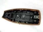 Seat pan underside with black mounting hardware and slots