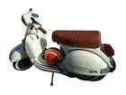 Dark brown single-seat saddle on scooter, side view