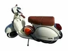 Dark brown single-seat saddle on scooter body, top view