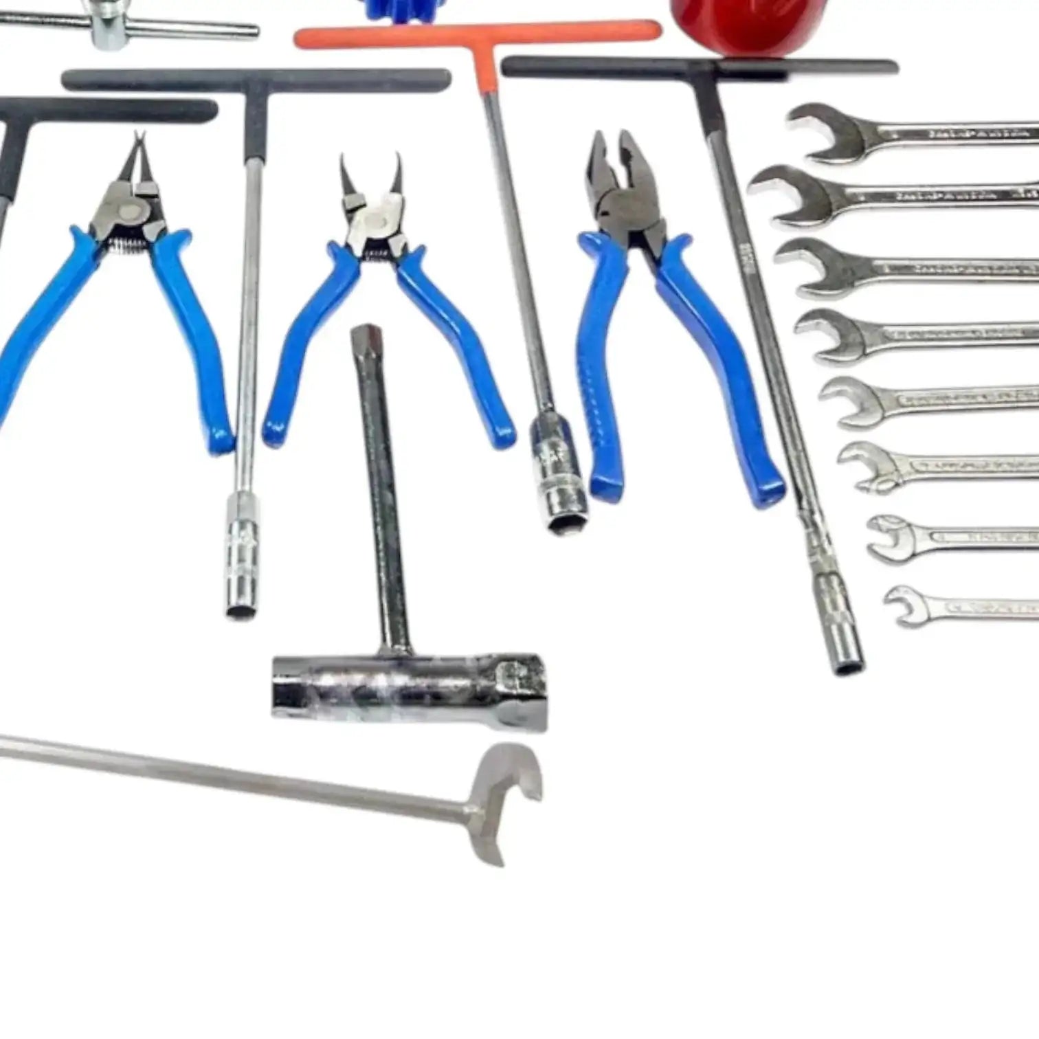 Workshop tool set detail: blue-handled pliers, screwdrivers, and multiple wrenches