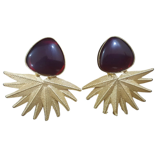 Vintage brass drop earrings with intricate leaf design and dark gemstone accents