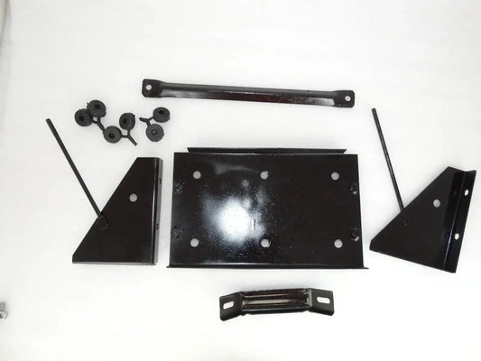 Vintage battery stand assembly parts: black metal brackets, plates, and hardware pieces