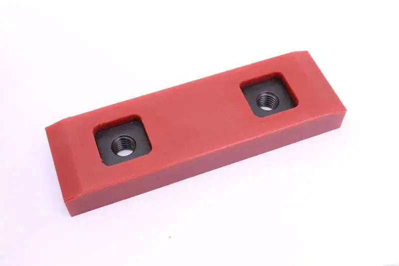 Red wear pad block with two threaded mounting holes