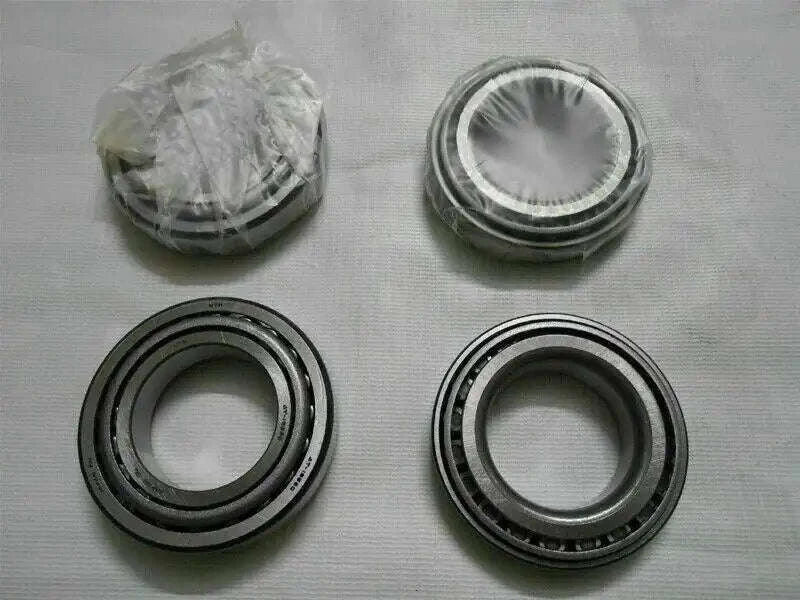 Wheel bearing kit with four metal bearing rings, includes stacked parts in bag