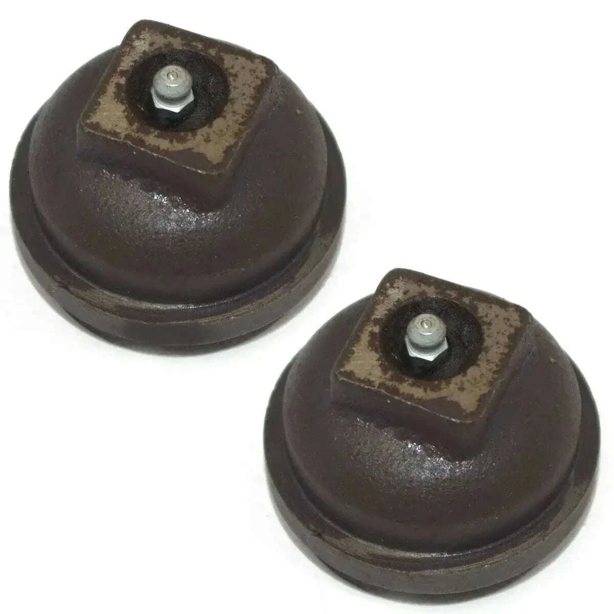Pair of dark wheel hub caps with central bolt, rubber-style covers